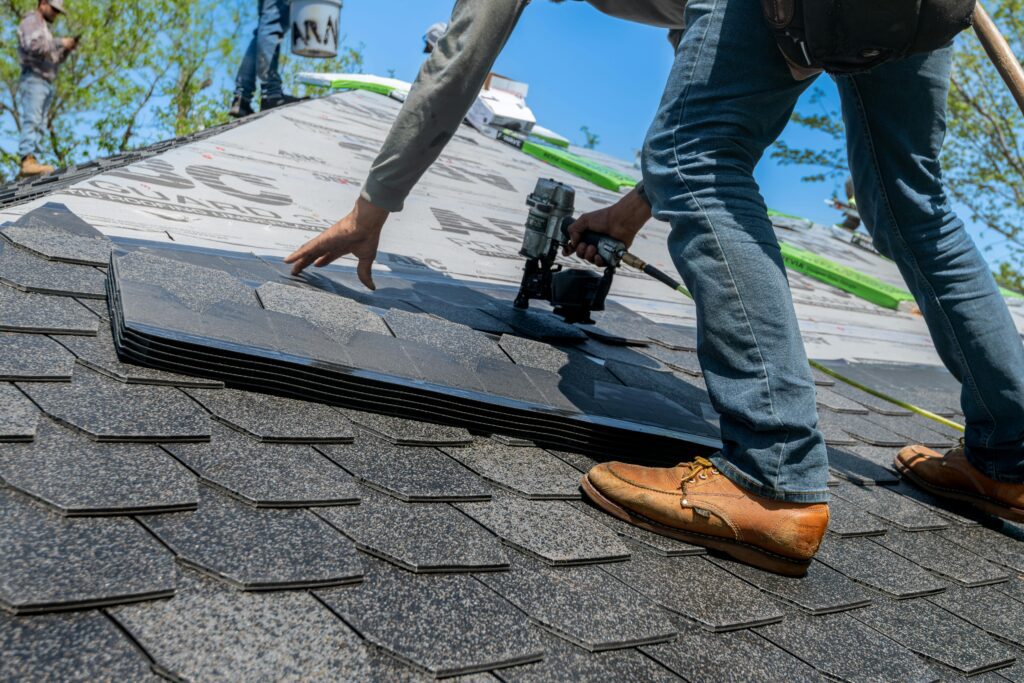 A roofing contractor repairing a leak on a Tampa home.